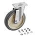 A metal wheel with a metal plate and screws.