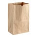 A close up of a brown ChoiceHD shorty natural kraft paper bag.