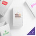 A white paper customizable bag with various printed logos, suitable for food service or retail use.
