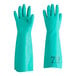 A pair of green Ansell AlphaTec Solvex nitrile gloves.