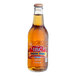 An IBC Cream Soda bottle with brown liquid and a red lid.