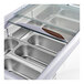 An Avantco gelato dipping cabinet with a glass top and a silver tray with four compartments inside.