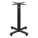 A FLAT Tech black metal table base with four legs.