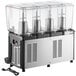 A Carnival King refrigerated beverage dispenser with four clear containers.