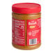 A jar of Lotus Biscoff creamy cookie butter spread on a table in a deli.