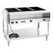 A stainless steel electric three-pan hot food table with a lower shelf and control knobs.