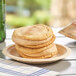 A stack of snickerdoodle cookies with sea salt caramel gelato in the middle on a plate.