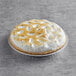 A Chef Pierre pre-baked lemon meringue pie with a white crust.