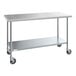 A Steelton stainless steel work table with casters.