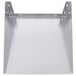 A close-up of a stainless steel metal shelf with holes.