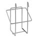 A Regency chrome metal glove box holder with clips on a metal shelf.