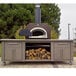 A Chicago Brick Oven wood-fired countertop pizza oven with a copper vein finish on a patio.