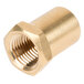 A close-up of a brass threaded nut on a gold piece.