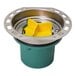 A green and yellow plastic Oatey freestanding tub drain with a yellow lid.