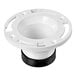 A white plastic Oatey Twist-N-Set water closet flange with a black rubber base.