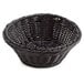 A black polyweave round bread basket with a handle.