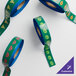 A roll of green and blue tape with custom designs.