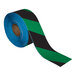 A roll of Superior Mark black and green striped safety tape.