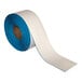 A roll of white and blue Superior Mark safety tape.