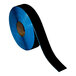 A roll of black Superior Mark safety tape.