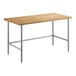 A Regency wood top work table with a galvanized base.