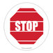 A red and white Superior Mark "Stop" safety floor sign.