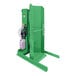 A green Valley Craft stationary drum dumper.