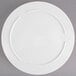 A white Thunder Group Nustone melamine divided server with a circular design.