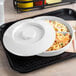 A white Thunder Group Nustone melamine divided server with food inside.