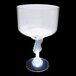 A clear plastic guitar stem margarita cup with a white LED light.