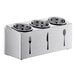 A stainless steel circular container with perforated cylinders holding flatware.