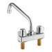 A silver deck-mount faucet with two handles and a gold knob.