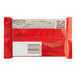 A close up of a red KIT KAT package with black text and a QR code.