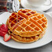 A Fanale mochi waffle with syrup on a white plate.