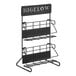 A black metal Bigelow tea rack with white text.