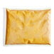 A white plastic bag of Muy Fresco Plant-Based Cheddar-Style vegan cheese sauce.