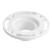 A white plastic circular Oatey water closet flange with holes in it.