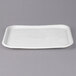 A white rectangular Huhtamaki Chinet molded fiber tray with a logo on it.