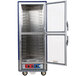 A blue Metro C5 heated holding and proofing cabinet with clear Dutch doors open on wheels.