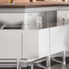 A Regency stainless steel counter with a 45-degree angle on it.