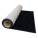 A roll of black FloorEXP event carpet on a white background.