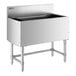 A stainless steel Regency underbar ice bin with legs.