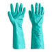 A close-up of a bag of Lavex green rubber gloves.