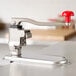 A red Vollrath Titan EaziClean can opener on a counter.