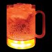 A customizable plastic mug with orange LED light filled with yellow liquid and ice.