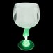 A close-up of a 12 oz. plastic guitar goblet with a green LED light.