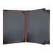 A black rectangular object with a brown leather cover.