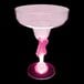 A pink plastic margarita glass with a pink LED light on the stem.