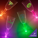 A close-up of a clear plastic champagne cup with a cactus stem and green LED light.