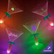 Three customizable plastic palm tree stem martini glasses with pink LED lights.